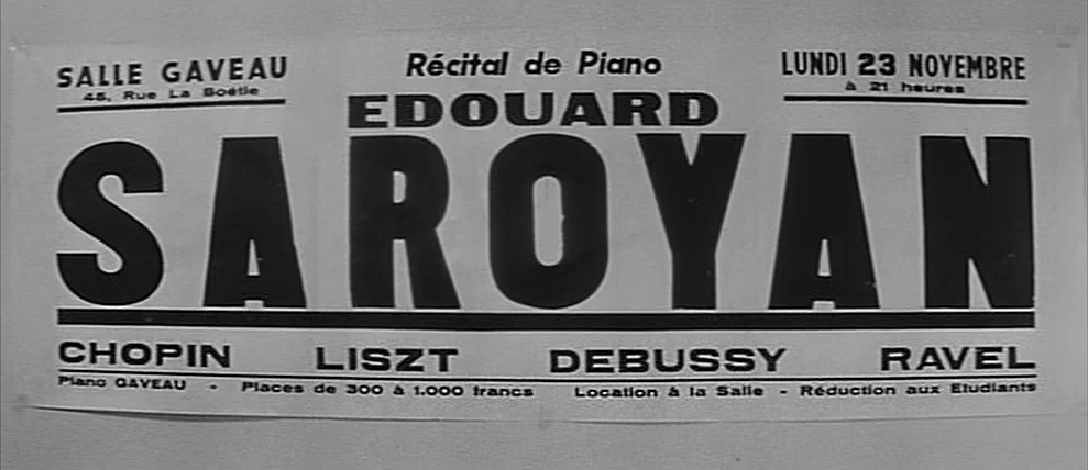 Shoot The Piano Player (Tirez Sur Le Pianiste) (1960) movie still: closeup — A rectangular promotional poster for a piano recital adheres to a flat…