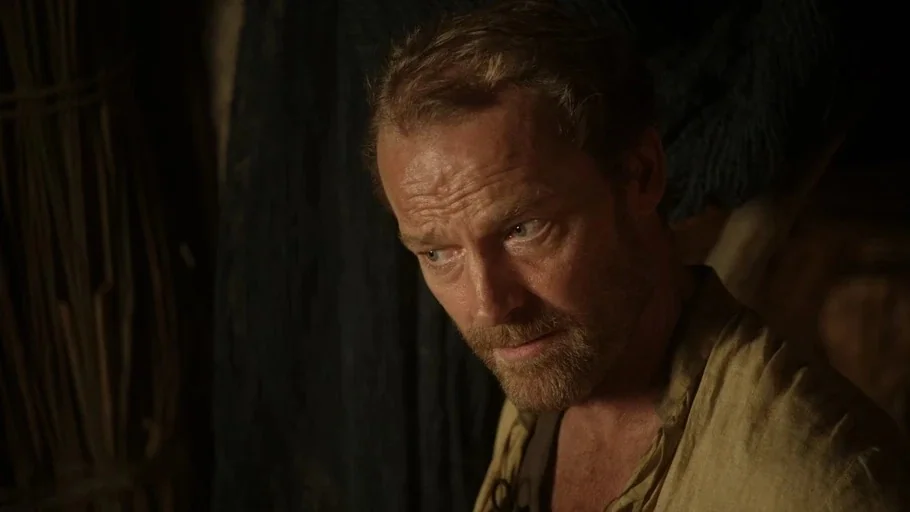 Game of Thrones: The Last Watch (2019) movie still: closeup — A dimly lit, rustic interior with dark textured walls suggests a primitive or…