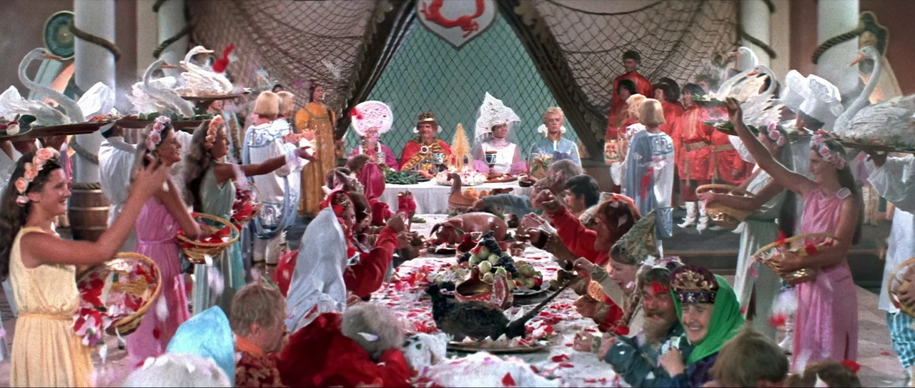 Through Fire, Water and… Brass Pipes (1968) movie still: wide — A large, ornate banquet hall features decorated tables laden with food and floral…