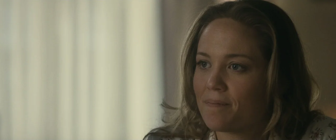The Case for Christ (2017) movie still: closeup — An interior space features a blurry, out-of-focus window background. A woman looks to the side…