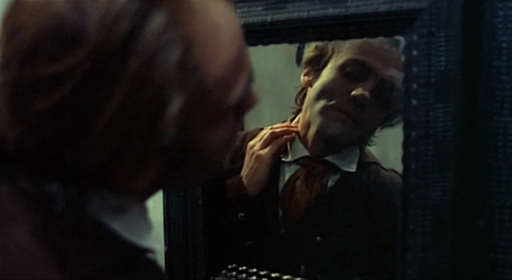 Nosferatu the Vampyre (Nosferatu Phantom Der Nacht) (1979) movie still: medium — A dark dressing room space containing a large wall-mounted mirror.…