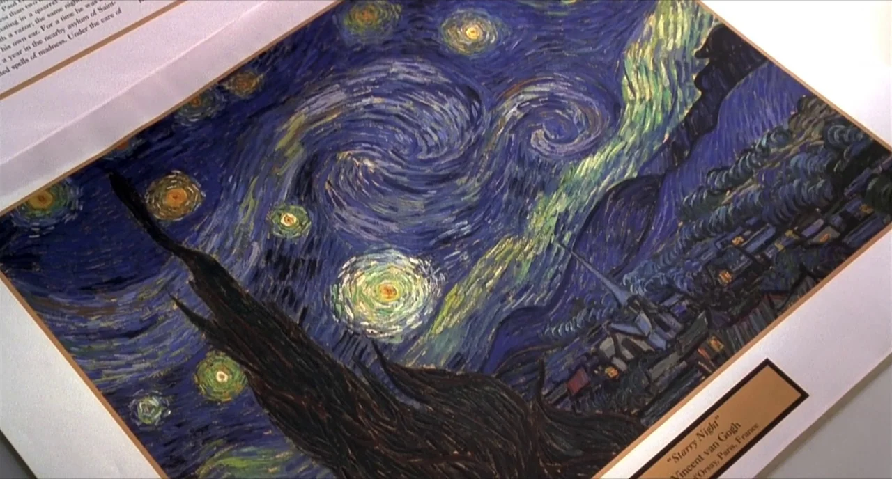 Pleasantville (1998) movie still: closeup — A book page displays a high-quality reproduction of a famous post-impressionist oil painting. The frame…