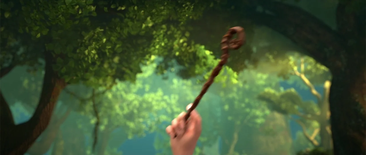 Cinderella and the Secret Prince (2018) movie still: closeup — A dense green forest clearing filled with mature trees and layered foliage. A human…