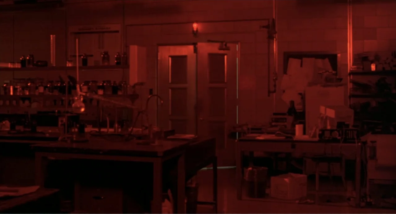 An Experiment in Fear: The Making of Monkey Shines (2014) movie still: wide — An abandoned science laboratory features workbenches cluttered with…