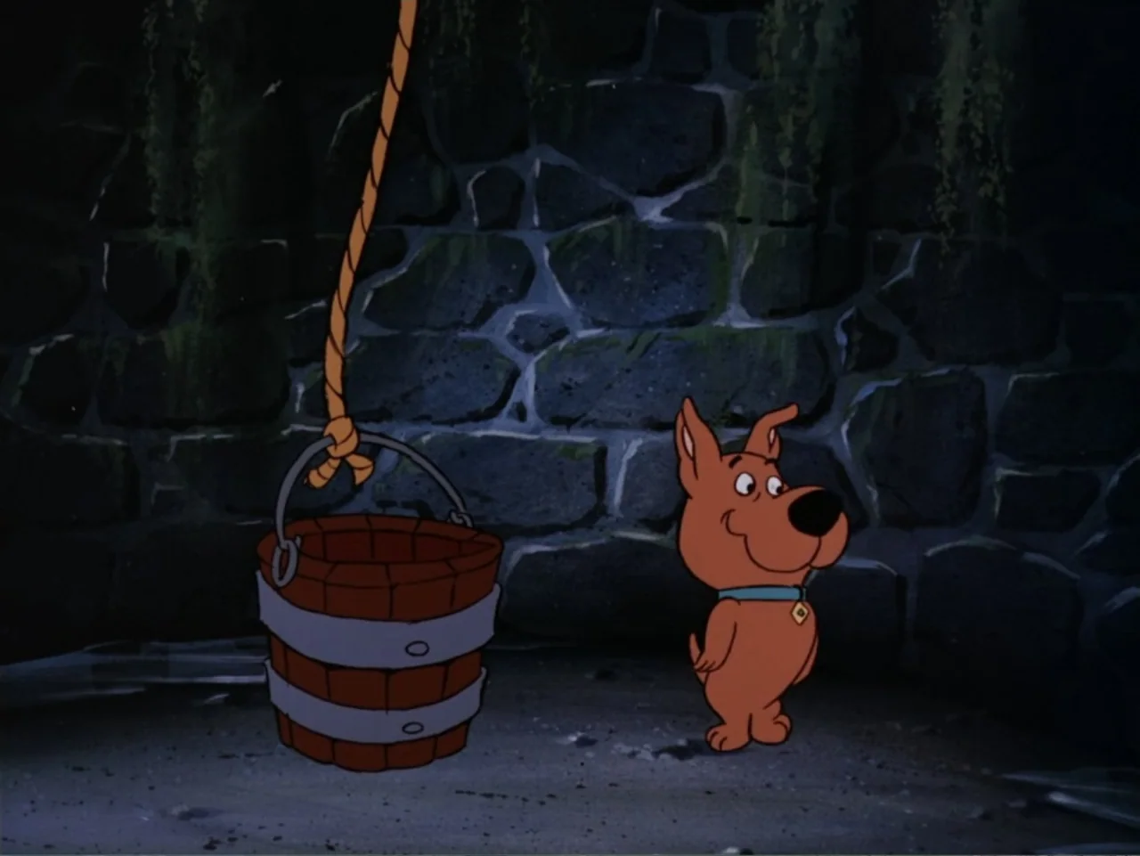Scooby-Doo! Meets the Boo Brothers (1987) movie still: medium — A dark stone-walled dungeon interior features mossy patches and dim ambient…