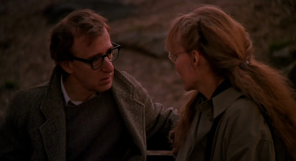 Crimes and Misdemeanors (1989) movie still: medium — An outdoor location during the golden hour with soft directional light. A man and a woman in…