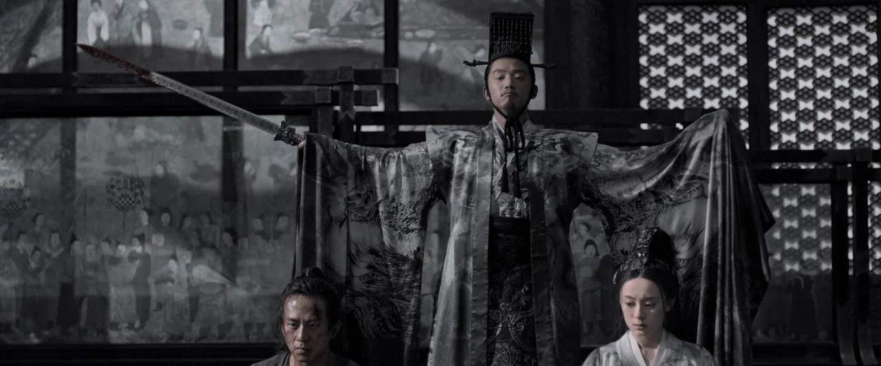 Shadow (2018) movie still: medium — A dark, wood-paneled interior features decorative screens adorned with traditional ink paintings. A central…