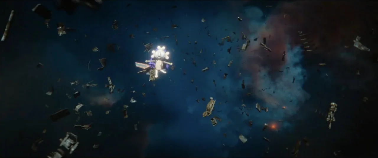 Star Trek: Section 31 (2025) movie still: wide — A dark cosmic environment filled with scattered metallic debris and nebulous gas clouds. A small…