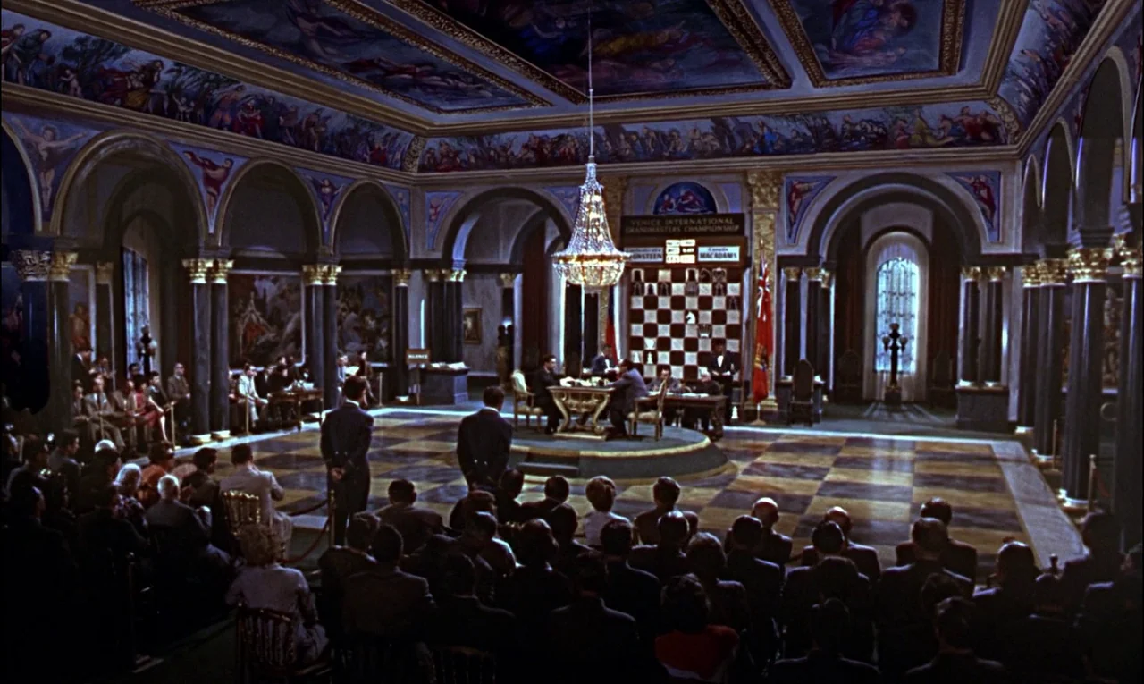From Russia With Love (1963) movie still: wide — A large ornate hall features a checkerboard floor and mural-covered vaulted ceilings. An audience…