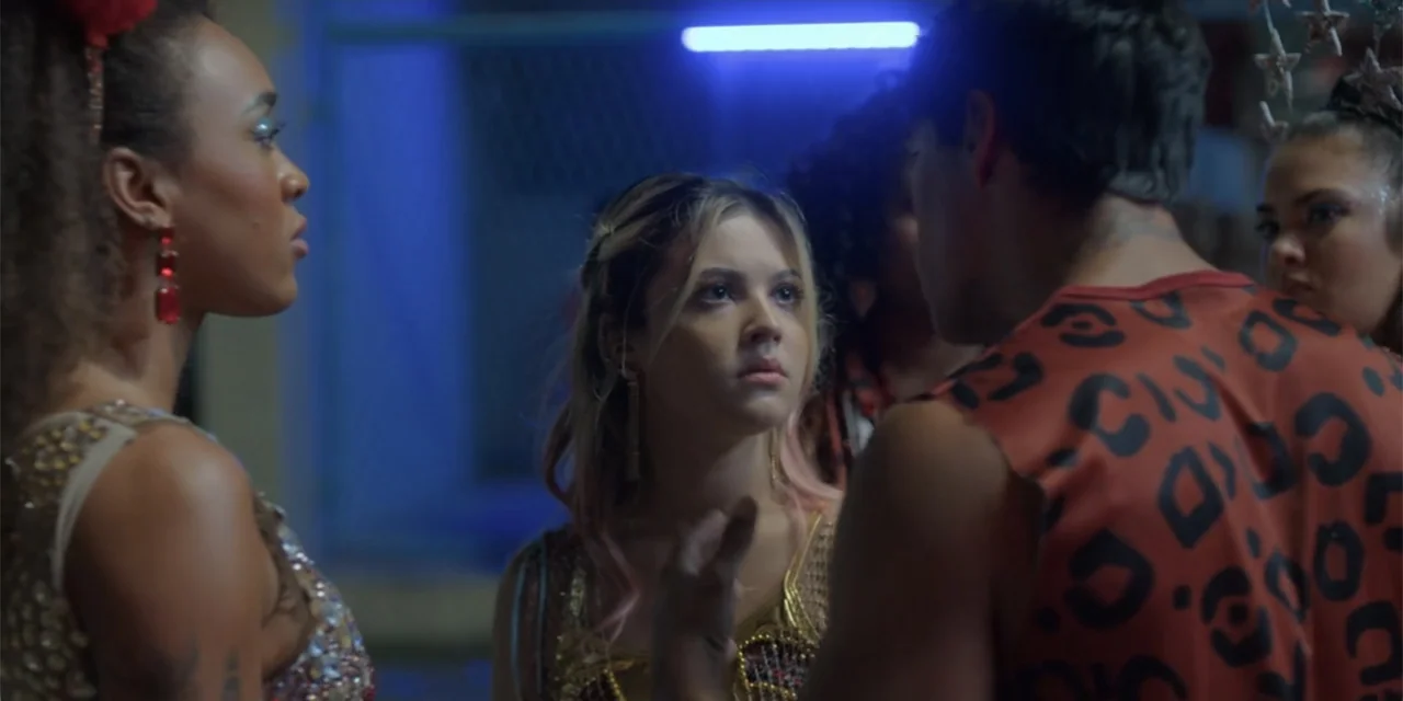 An Unforgettable Year - Summer (2023) movie still: medium — A dimly lit club interior features a group of young people interacting near a wall. A…