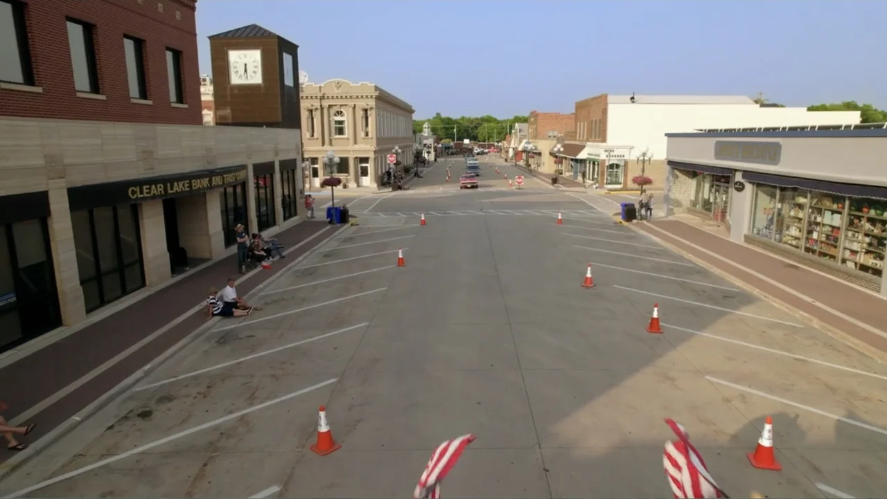 The Day the Music Died: The Story of Don McLean's "American Pie" (2022) movie still: establishing — A wide view of a small town main street lined…
