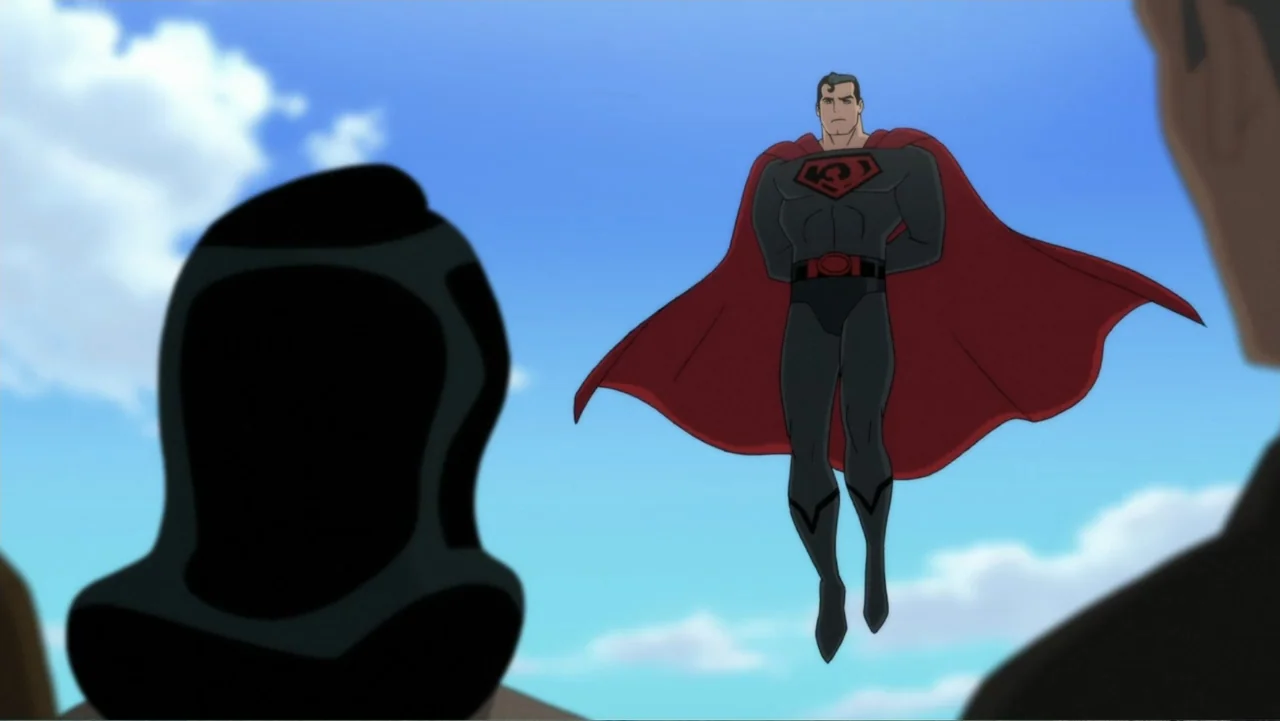 Superman: Red Son (2020) movie still: fullbody — A figure in a dark suit floats against a bright blue sky. Other silhouetted individuals watch from…