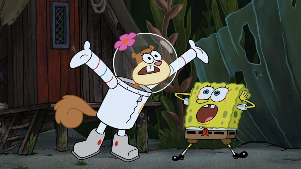 SpongeBob Squarepants: Kreepaway Kamp (2024) movie still: medium — A wooden structure with a window stands beside green foliage and a weathered blue…