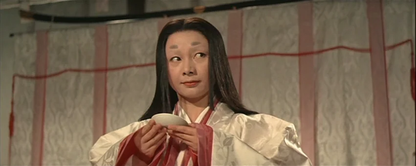 Kwaidan (1964) movie still: medium — A room with white fabric partitions decorated with red ropes and patterns. A woman in traditional silk robes…