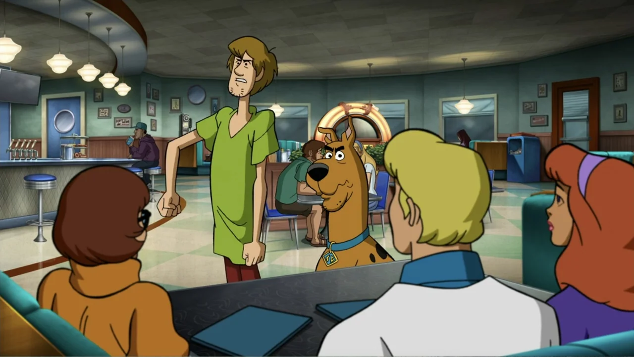 Scooby-Doo! Return to Zombie Island (2019) movie still: medium — A brightly lit diner interior features colorful booths and classic ceiling pendant…