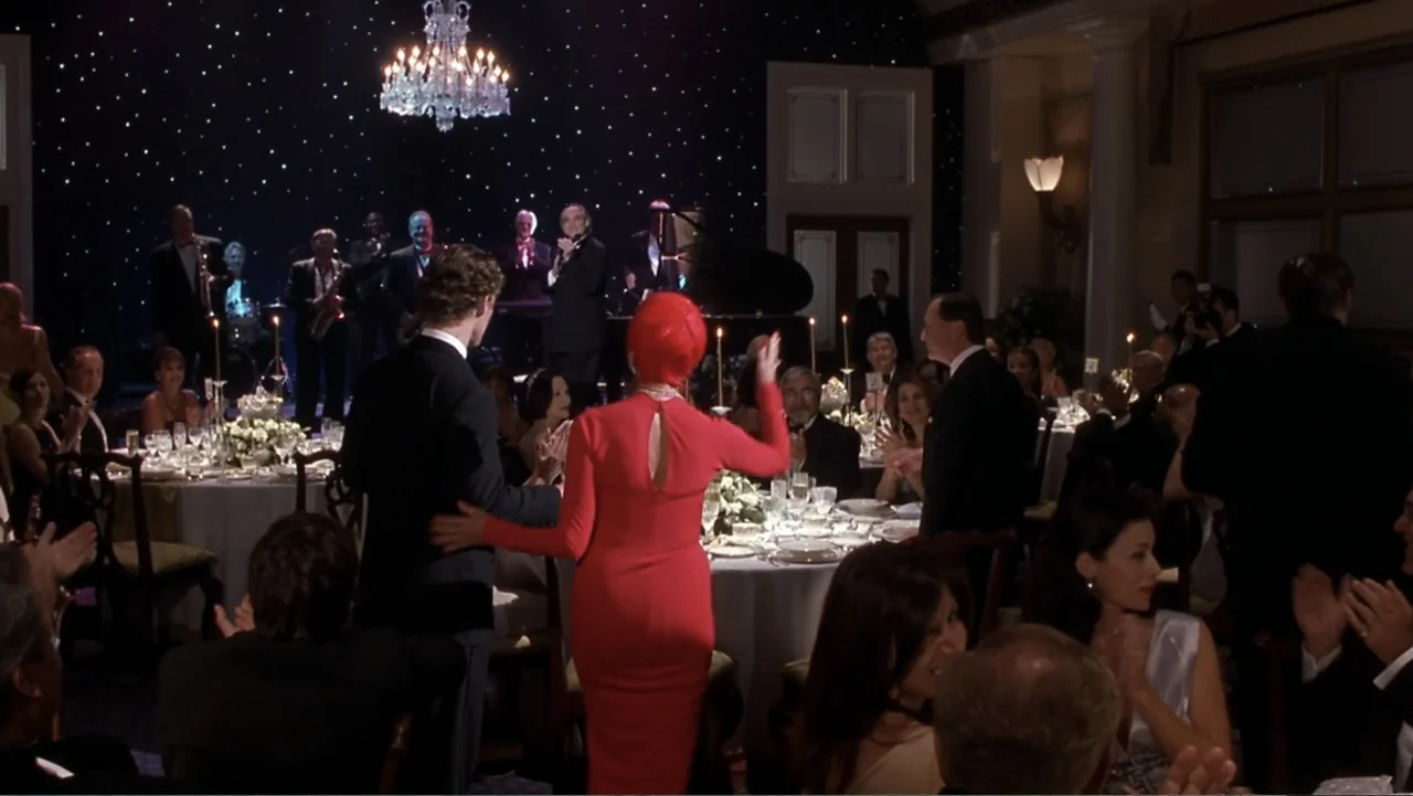 How to Lose a Guy in 10 Days (2003) movie still: wide — A formal ballroom event features round dinner tables and a backdrop with star-like lights. A…