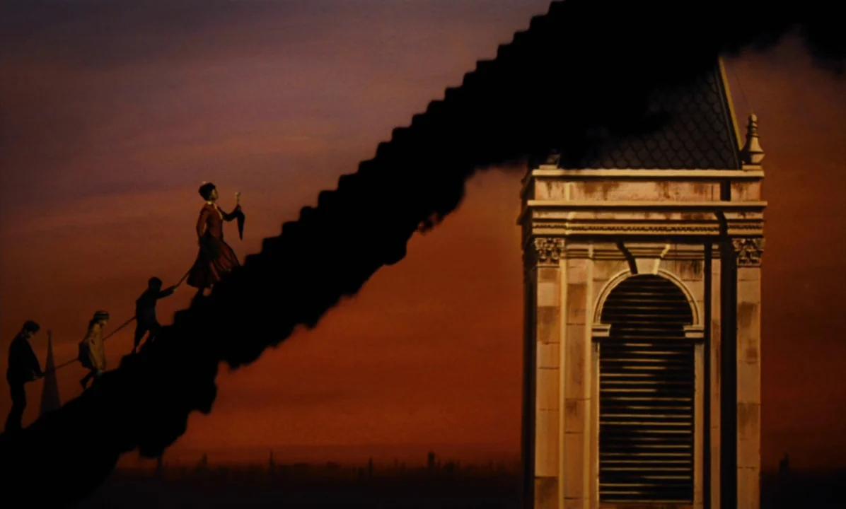 Mary Poppins (1964) movie still: wide — A group of figures walks along a narrow ledge high above a city skyline. The silhouette of a clock tower…