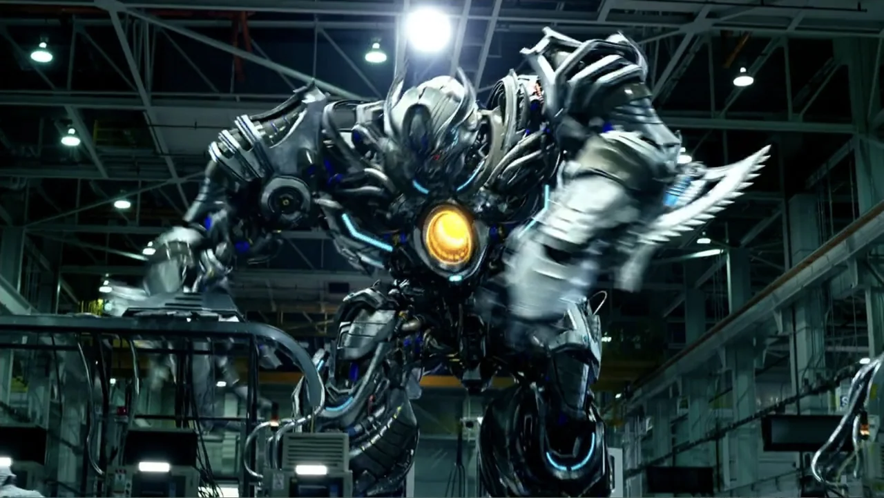 Transformers: Age of Extinction (2014) movie still: fullbody — An industrial manufacturing facility contains complex support beams and overhead…