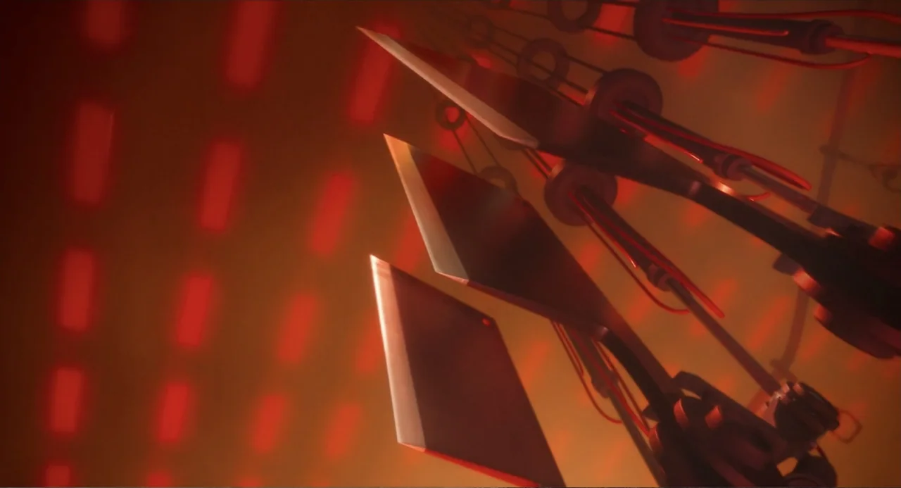 The Garfield Movie (2024) movie still: closeup — Sharp metallic blades hang suspended from pulleys inside a dim, red-lit interior space. The objects…