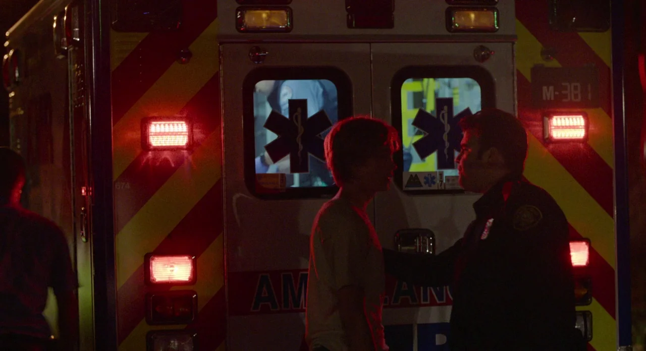 Lean on Pete (2017) movie still: medium — The rear doors of an ambulance feature large blue medical star symbols and red reflectors. A paramedic…