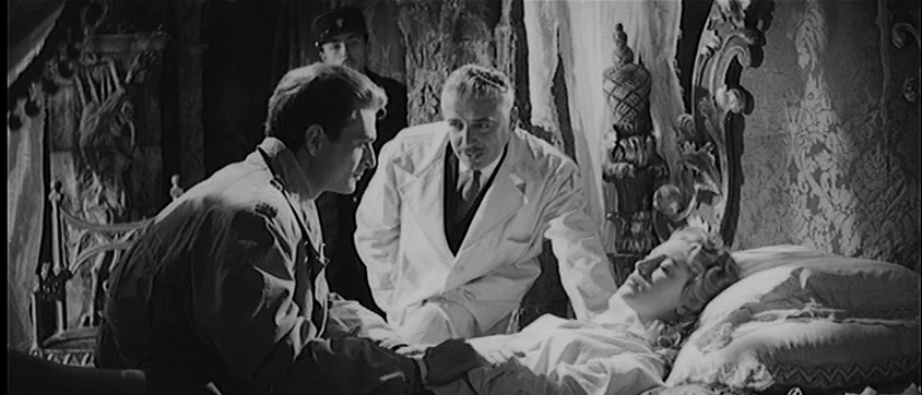 I Vampiri (1957) movie still: medium — A dimly lit bedroom with ornate furniture and a large, carved wooden headboard. A man in uniform leans over a…