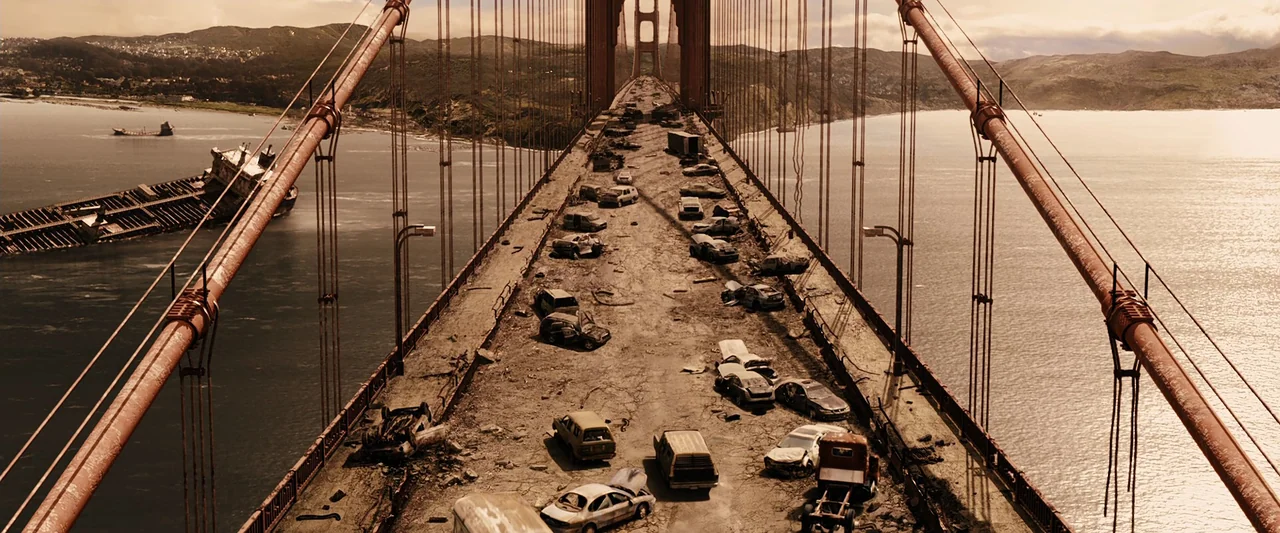 The Book of Eli (2010) movie still: establishing — The Golden Gate Bridge is covered in abandoned, rusted vehicles and debris. A large cargo ship…
