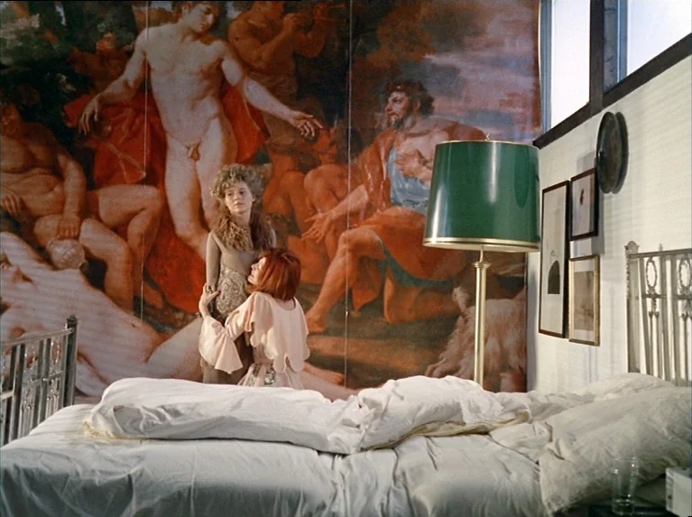 The Bitter Tears Of Petra Von Kant (1972) movie still: medium — A room features a large mural depicting classical figures covering the back wall.…