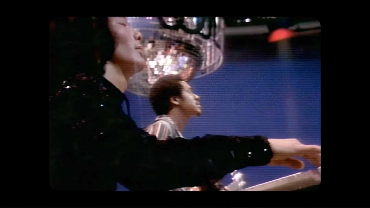 Mary J. Blige's My Life (2021) movie still: medium — A dimly lit recording studio features a musician playing a keyboard while another performs…