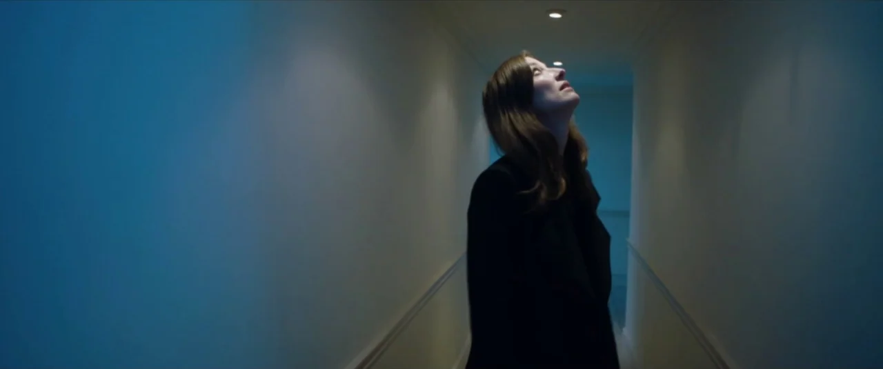 Happy New Year, Colin Burstead (2018) movie still: medium — A narrow residential hallway with white walls and a single recessed light fixture. A…