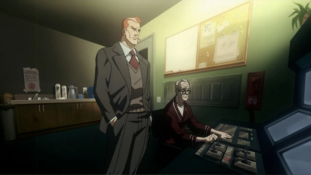Superman/Shazam!: The Return of Black Adam (2010) movie still: medium — A dimly lit security control room features green walls with an attached…