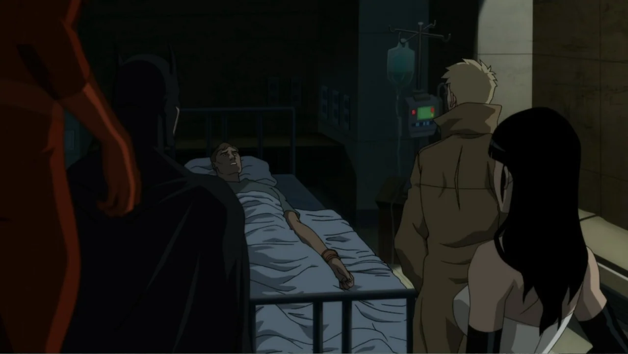 Justice League Dark (2017) movie still: medium — A dimly lit hospital room features medical equipment and a patient in a bed. Three individuals…
