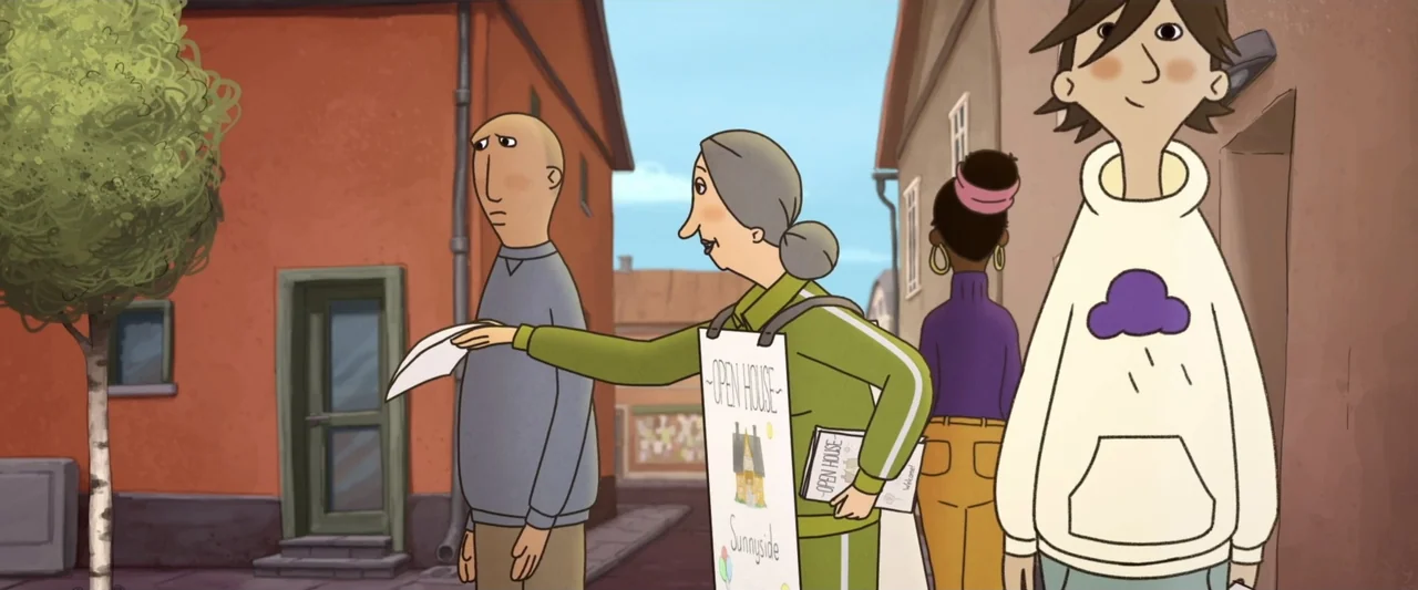 The Ape Star (2021) movie still: medium — A narrow residential street with orange buildings and paved ground. A woman holding a sign hands a white…