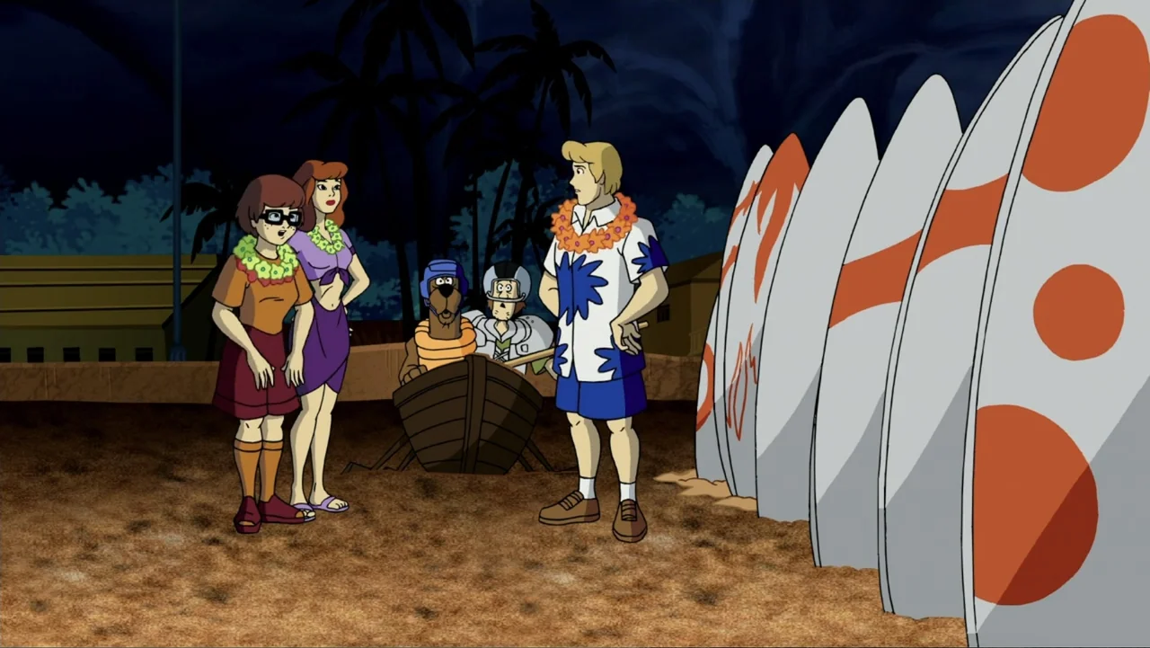 Aloha Scooby-Doo! (2005) movie still: medium — A sandy beach at night features a group of four friends standing together. A row of large surfboards…
