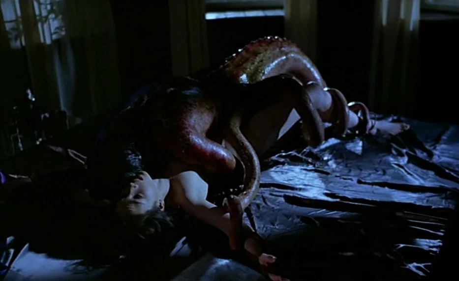 Possession (1981) movie still: medium — A dimly lit room with dark bedding and translucent curtains over a window. A woman lies on the bed while…