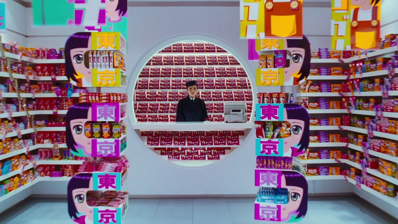 Charlie and The Chocolate Factory (2005) movie still: wide — A brightly lit candy store features shelves stocked with colorful products and…