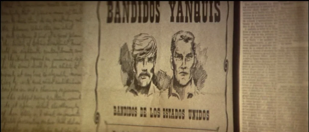 Butch Cassidy and the Sundance Kid (1969) movie still: closeup — A vintage wanted poster titled Bandidos Yanquis is centered on a textured paper…