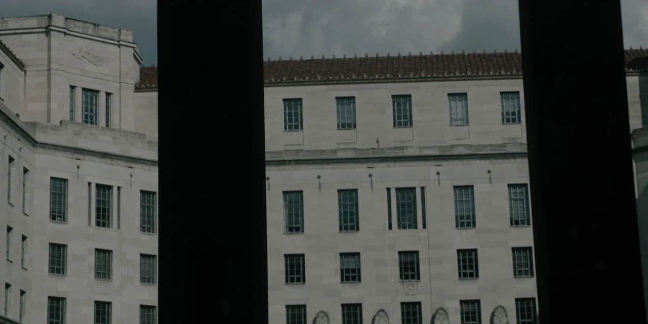 Mark Felt: The Man Who Brought Down the White House (2017) movie still: establishing — A large stone government building with rows of windows stands…