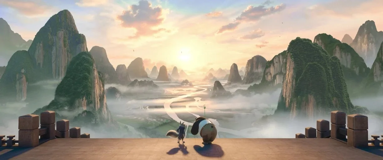 Kung Fu Panda 4 (2024) movie still: wide — A stone balcony overlooks a expansive valley with winding rivers and jagged limestone karst formations. A…