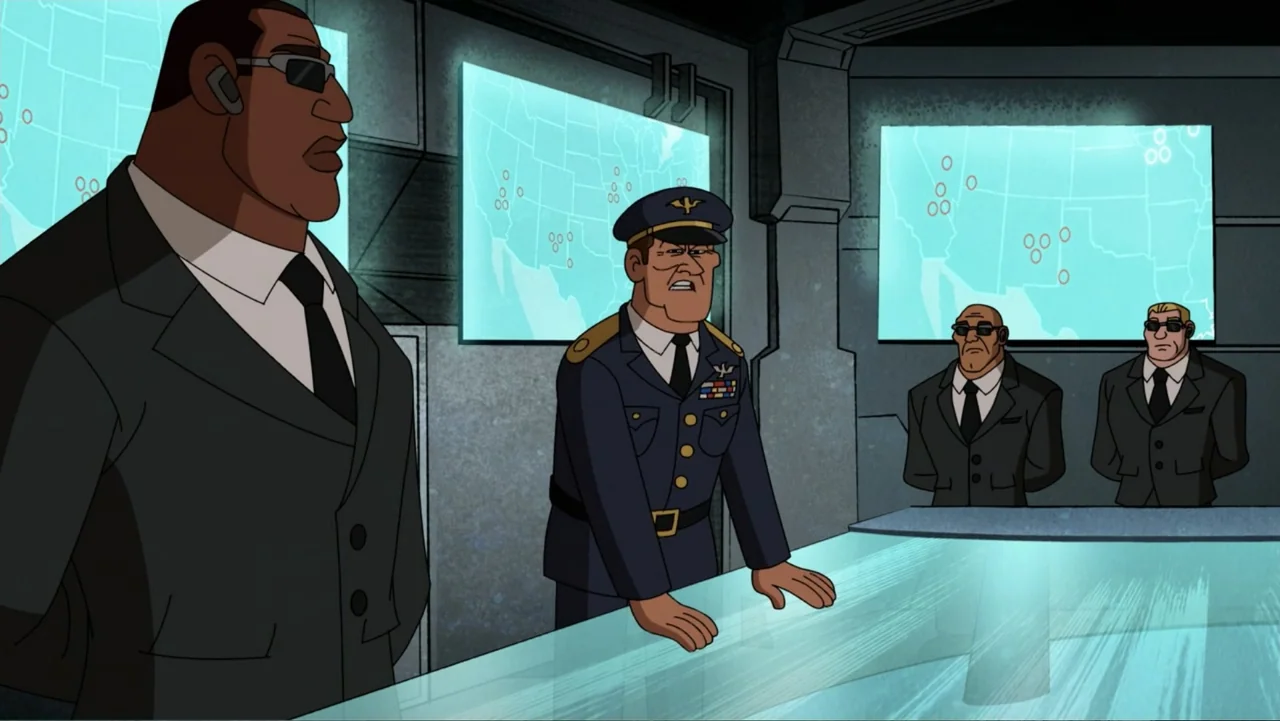 Ben 10: Ben 10,010 (2021) movie still: medium — A high-tech command center features glowing maps on walls and a central console. A military general…