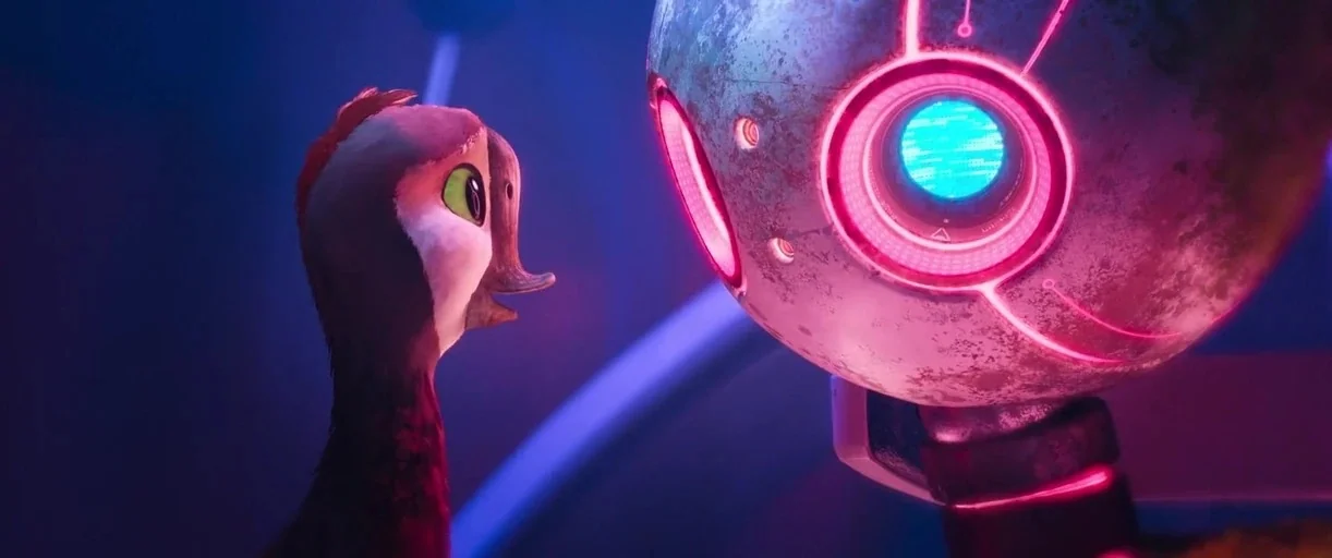 The Wild Robot (2024) movie still: medium — A dark, metallic environment filled with blue ambient light and glowing neon circuitry. A small creature…