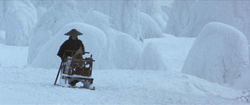 Lone Wolf and Cub: White Heaven in Hell (1974) movie still: wide — A vast, white, snow-covered landscape features rounded, snow-encrusted rock or…