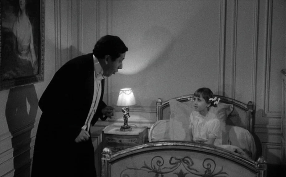 Judex (1966) movie still: medium — An elegant bedroom features paneled walls and a portrait hanging above the headboard. A man in formal wear leans…
