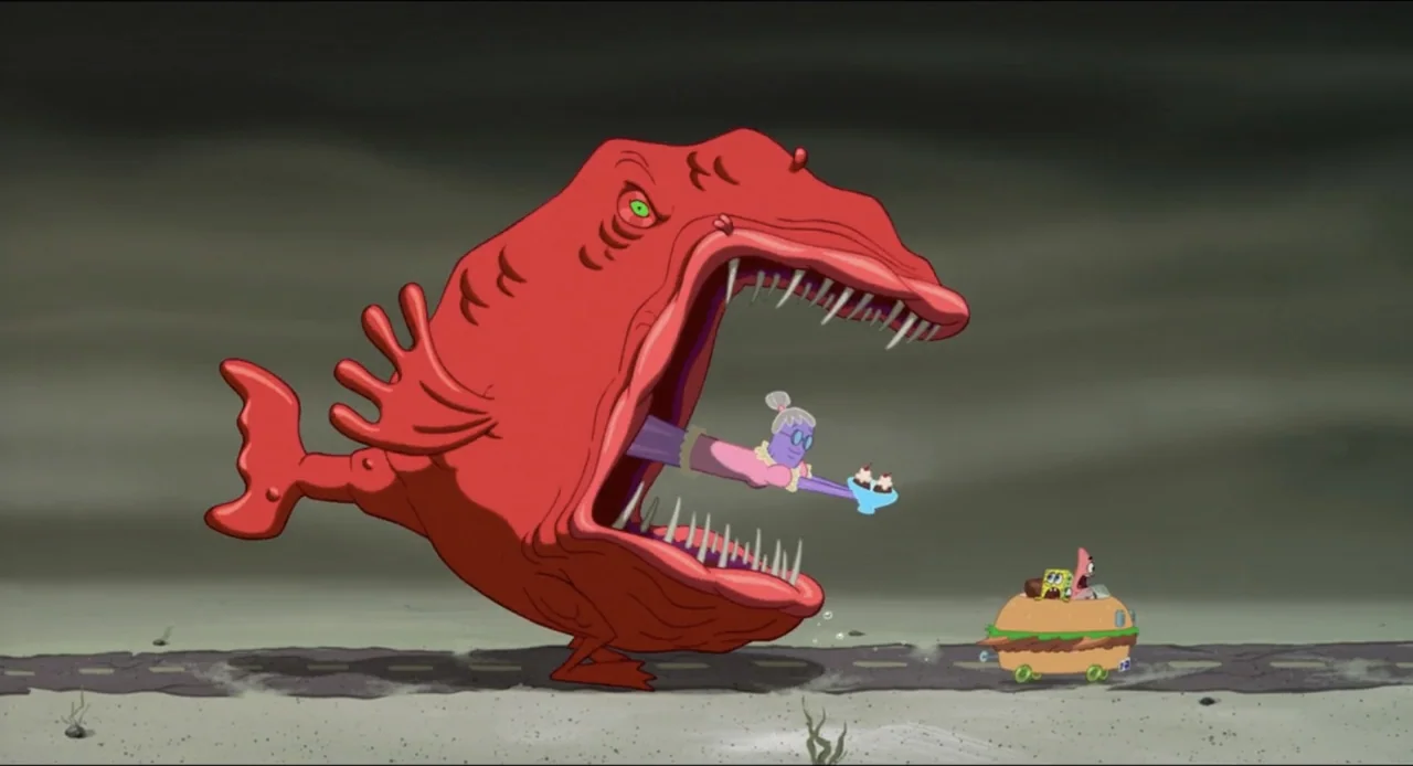 The SpongeBob SquarePants Movie (2004) movie still: wide — A deep sea floor with a gray sandy bottom under a dark expanse. A giant red fish swallows…