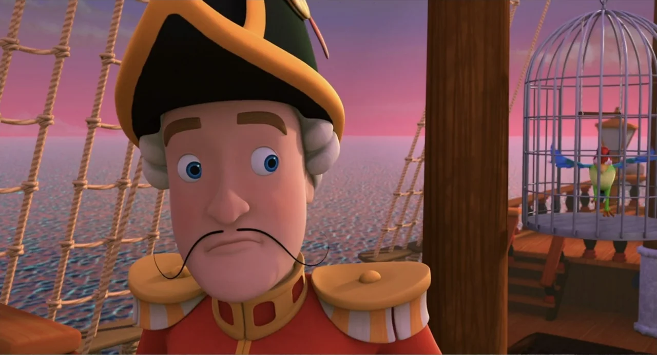Capt'n Sharky (2018) movie still: medium — A wooden ship deck is visible against a sunset horizon over the open ocean. A man in a red uniform stands…
