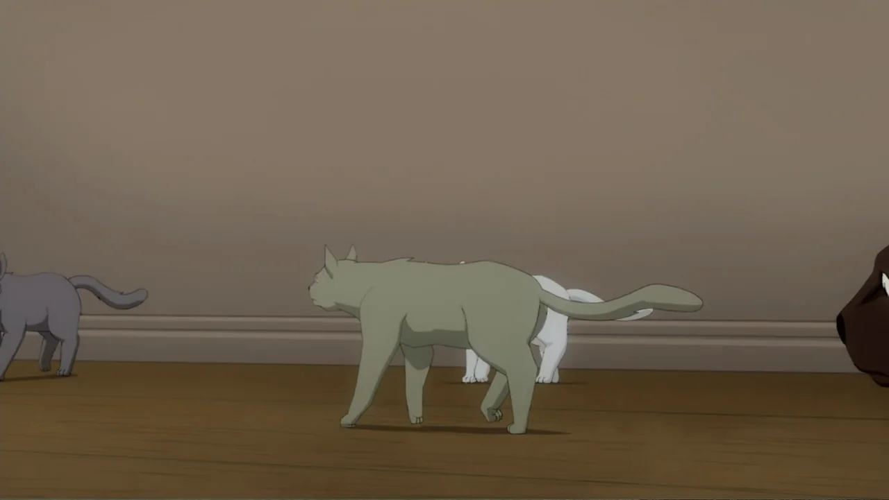 Batman: Year One (2011) movie still: medium — A spartan room with plain tan walls and a dark wooden floor. Three cats of different colors walk…