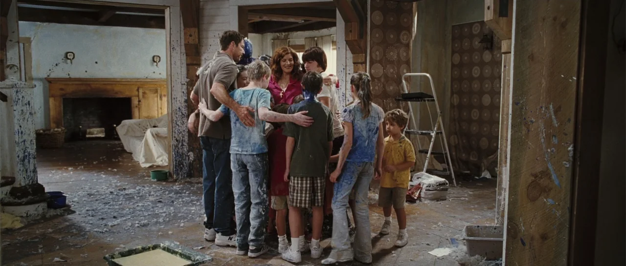 Yours, Mine & Ours (2005) movie still: fullbody — A room undergoing renovation with wooden framing, patterned wallpaper, and debris on the floor. A…