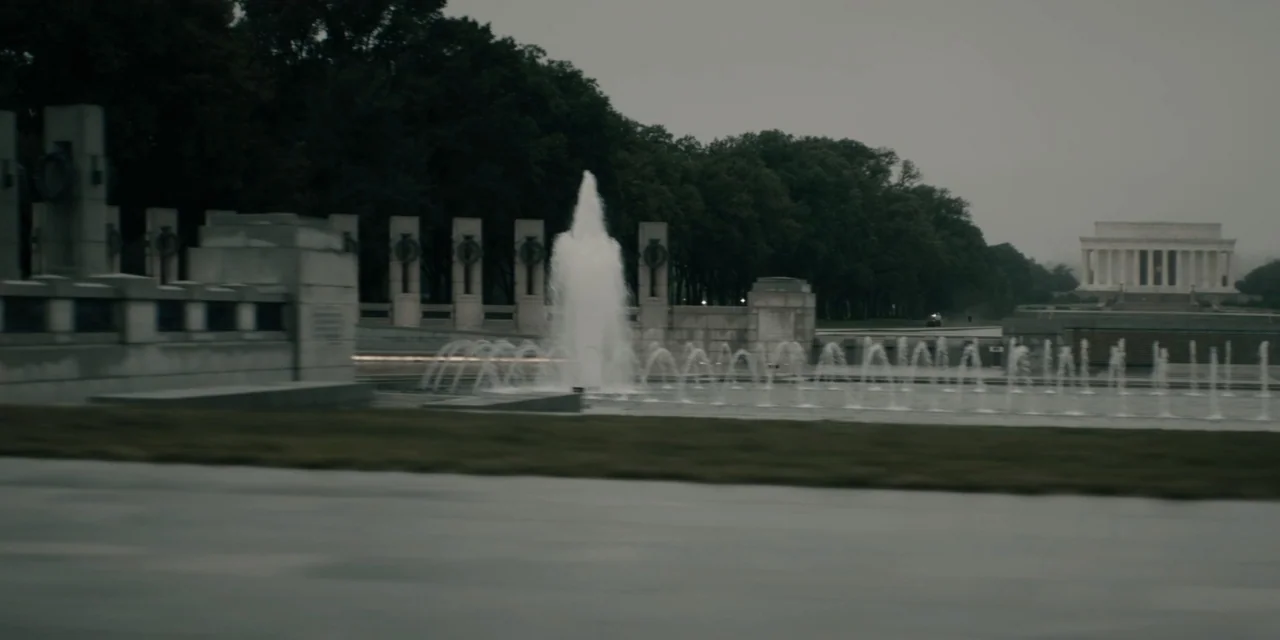 Mark Felt: The Man Who Brought Down the White House (2017) movie still: wide — The World War II Memorial features stone pillars and a large central…