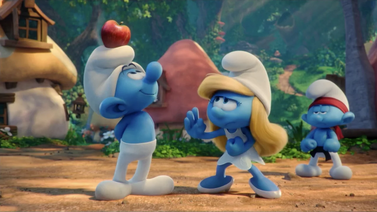 Smurfs: The Lost Village (2017) movie still: medium — A fantasy village clearing features mushroom-shaped houses amidst green trees and dirt paths.…