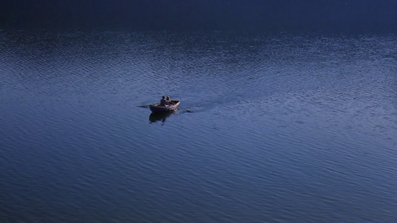 Friday the 13th Part VIII: Jason Takes Manhattan (1989) movie still: wide — A small wooden rowboat sits in the middle of a vast, calm body of water.…
