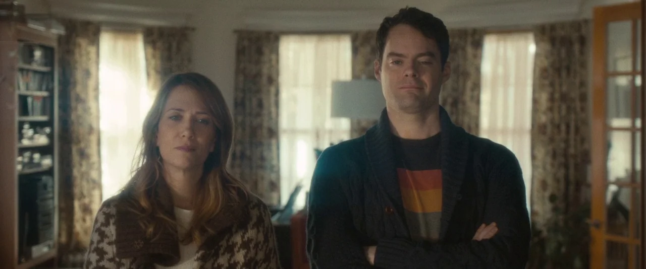 The Skeleton Twins (2014) movie still: medium — A domestic space features windows with floral curtains and an open door frame. A man and a woman…